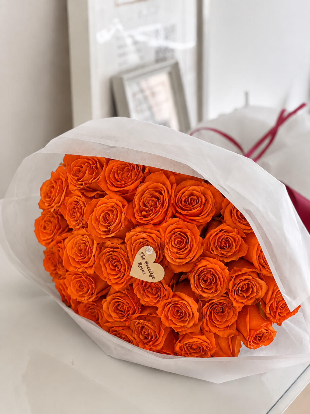 Ramo de rosas frescas naranjas premium con entrega el mismo día en Madrid